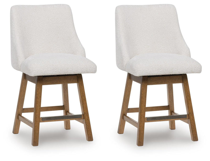 Ashley Furniture Cabalynn counter height barstool with wooden legs and cushioned seat, shown from a side angle.