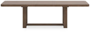 Ashley Furniture Cabalynn dining extension table with a dark wood finish, shown from the back angle.