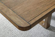 Close-up of the Ashley Furniture Cabalynn dining room set table surface with detailed wood grain finish