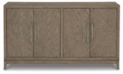 Ashley Furniture Chrestner dining server with wood finish, featuring multiple storage compartments and elegant design details.