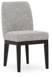 Ashley Furniture Burkhaus dining room set with a wooden table and matching chairs, viewed from an angle.