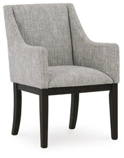 Ashley Furniture Burkhaus dining room set with a rectangular table and six upholstered chairs, shown from an angled side view.