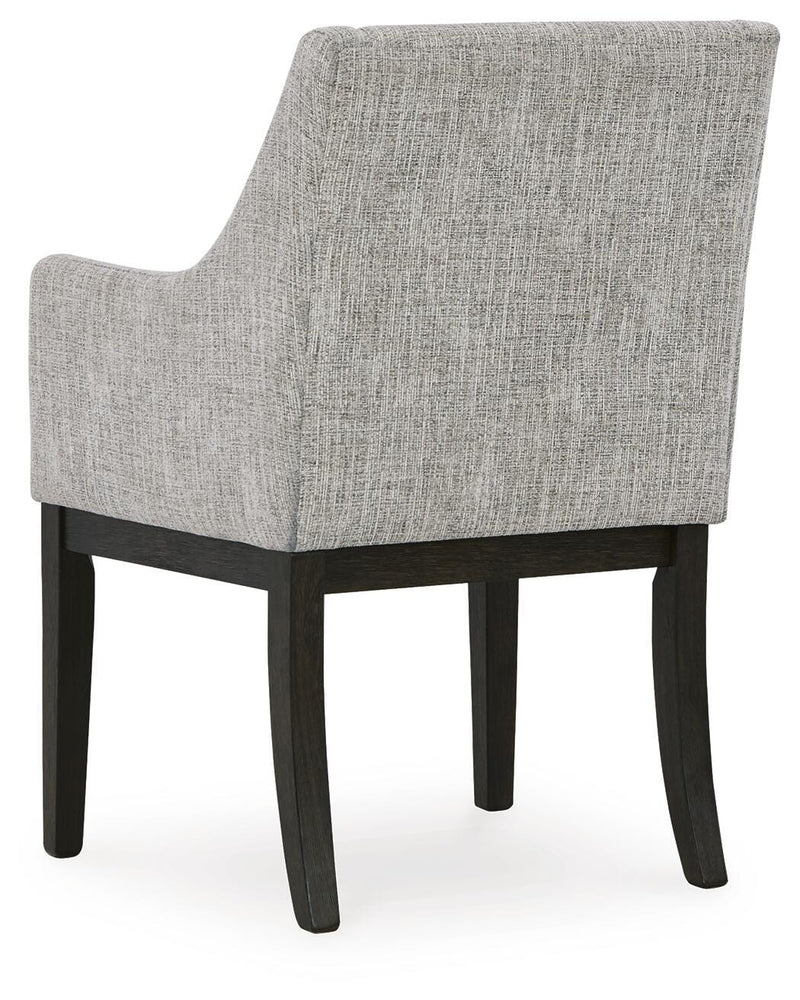 Ashley Furniture Burkhaus dining room set with a table and chairs, shown from the back in a modern dining space.