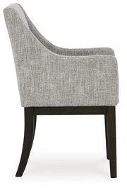 Ashley Furniture Burkhaus dining room set with a dining table and chairs, shown from the side view, in a modern home setting.