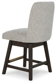 Ashley Furniture Burkhaus counter height barstool featuring a wooden frame and upholstered backrest, shown from an angled rear view.