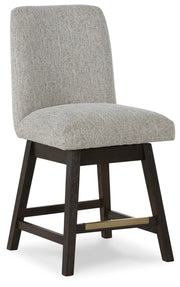 Ashley Furniture Burkhaus dining room set with a round table and six upholstered chairs, shown from an angled side view.