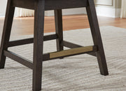 Ashley Furniture Burkhaus counter height barstool with wooden legs and upholstered seat, shown from a detailed angle.