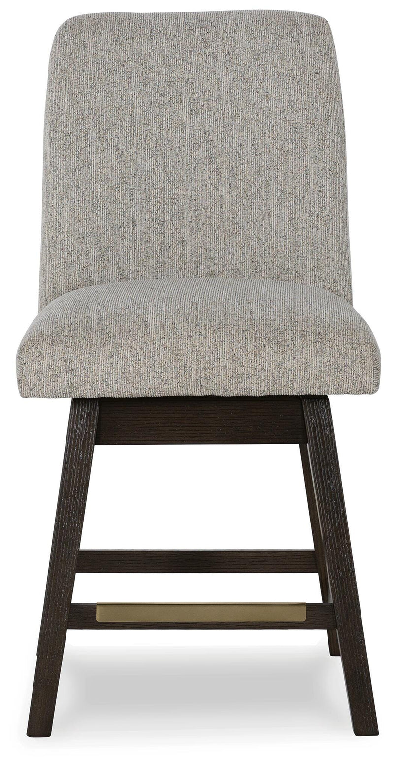 Ashley Furniture Burkhaus counter height barstool with a wood finish and padded seat, shown from the front in a modern dining setting.