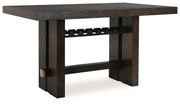 Ashley Furniture Burkhaus dining room set with a wooden table and matching chairs, shown from an angled perspective.