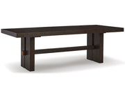 Angle view of Ashley Furniture Burkhaus dining room set with a wooden table and six matching chairs in a modern dining space.