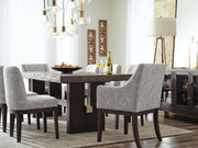 Ashley Furniture Burkhaus dining room set with a wooden table and matching chairs in a modern style.