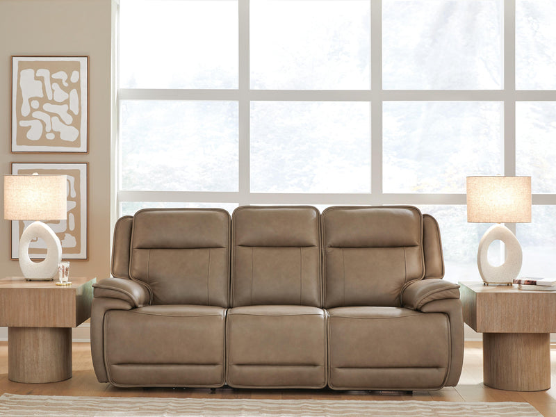 Ashley Furniture Glencroft power reclining sofa with plush cushions and dark upholstery, showing its reclining mechanism and contemporary design.