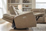 Ashley Furniture Glencroft power reclining sofa with plush cushions and reclining features, shown in a modern living room setting.