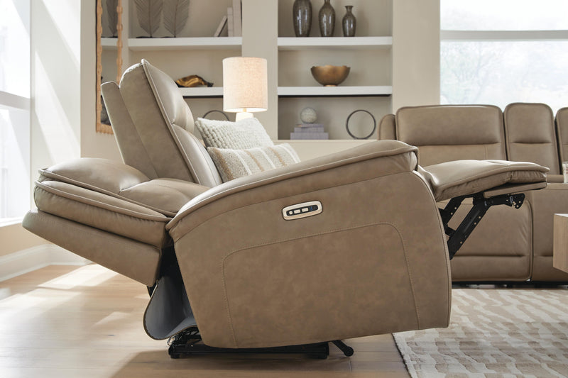 Ashley Furniture Glencroft power reclining sofa with plush cushions and reclining features, shown in a modern living room setting.
