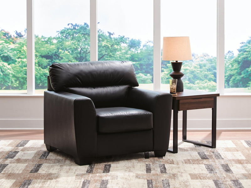 Ashley Furniture Glennbre Chair with plush upholstery and wooden legs, showcasing a modern design perfect for living rooms.