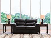 Ashley Furniture Glennbre loveseat with plush beige upholstery and cushioned arms, perfect for cozy living room seating.
