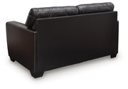 Comfortable Ashley Furniture Glennbre loveseat with plush cushions and modern design, perfect for cozy living room seating.