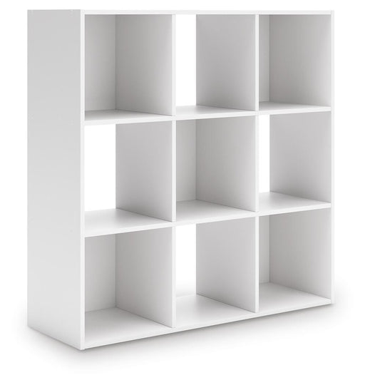 Ashley Furniture Onita Nine Cube Organizer with 3x3 cube storage, angled view showing wood finish and versatile modular design.