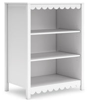 Ashley Furniture Hallityn bookcase with multiple shelves and open storage for books and decor, angled view showing wood finish.