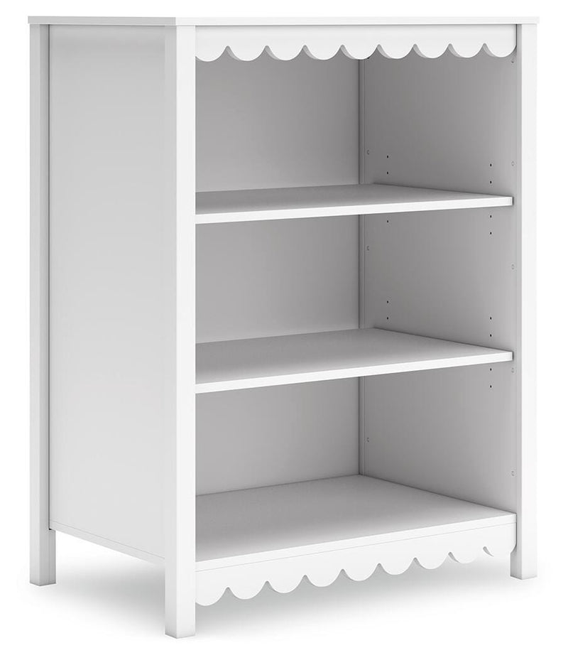 Ashley Furniture Hallityn bookcase with multiple shelves and open storage for books and decor, angled view showing wood finish.