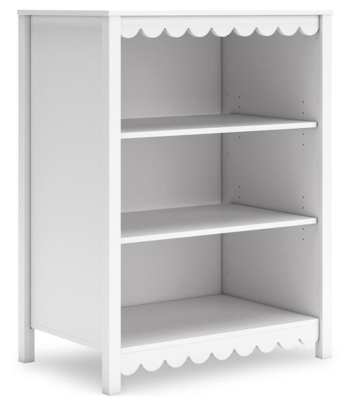 Ashley Furniture Hallityn bookcase with multiple shelves and open storage for books and decor, angled view showing wood finish.