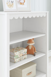 Ashley Furniture Hallityn bookcase with open shelves and wood finish, perfect for living room or office storage.