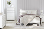 Ashley Furniture Hallityn chest of drawers with a modern wood finish and multiple storage drawers.