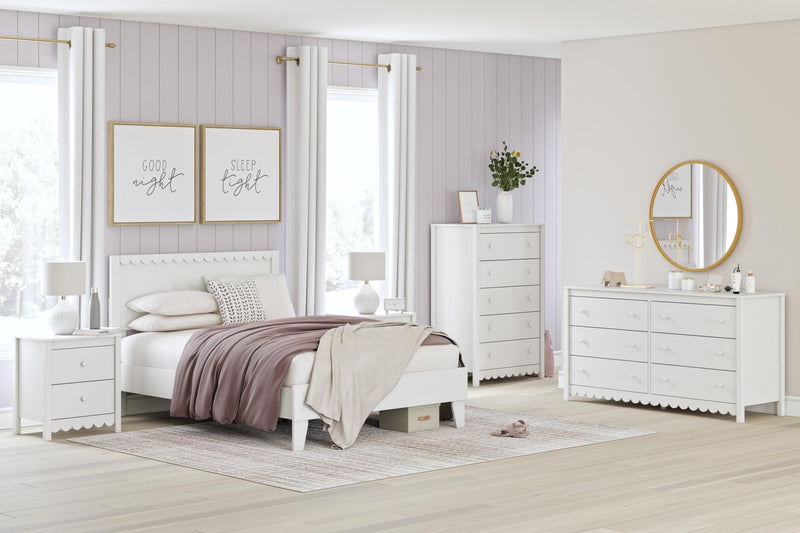 Ashley Furniture Hallityn nightstand with a dark wood finish, featuring a single drawer and open shelf for bedside storage.