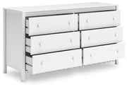 Ashley Furniture Hallityn dresser shown from an angle with open top drawers, showcasing its spacious storage and modern design.