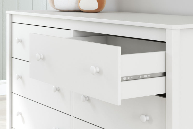 Ashley Furniture Hallityn Dresser with multiple drawers and sleek finish, showcasing its elegant and functional bedroom storage design.