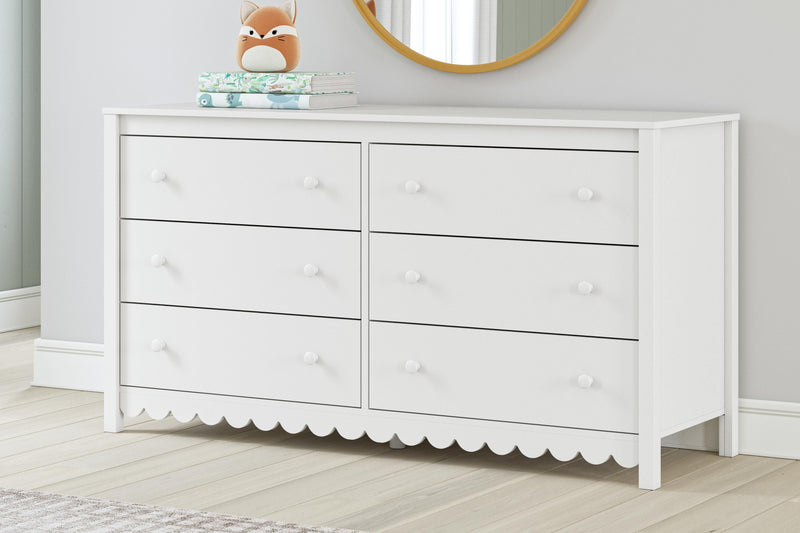 Ashley Furniture Hallityn Dresser with multiple drawers and a rustic finish, ideal for bedroom storage and organization.