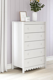 Ashley Furniture Hallityn chest of drawers showing a wooden bedroom storage chest with multiple drawers and a modern design.
