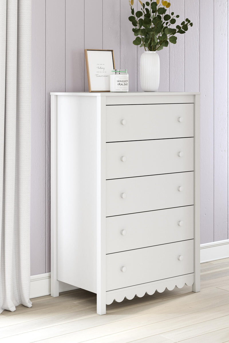 Ashley Furniture Hallityn chest of drawers showing a wooden bedroom storage chest with multiple drawers and a modern design.
