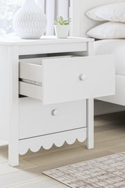Ashley Furniture Hallityn nightstand with a dark wood finish and sleek drawer handle, designed for bedroom storage and style.