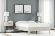 Ashley Furniture Socalle Panel Bed with a sleek wooden frame and modern design, shown in a stylish bedroom setting