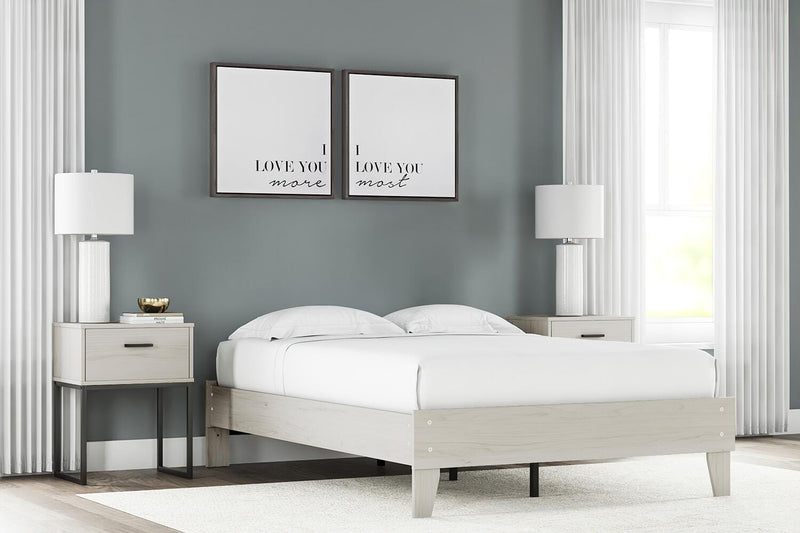 Ashley Furniture Socalle Panel Bed with a sleek wooden frame and modern design, shown in a stylish bedroom setting