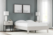 Ashley Furniture Socalle panel bed with a dark wood finish, featuring a sturdy headboard and sleek design for a modern bedroom.