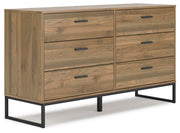 Ashley Furniture Deanlow bedroom set with a bed, matching nightstands, and dressers in a modern bedroom arrangement.