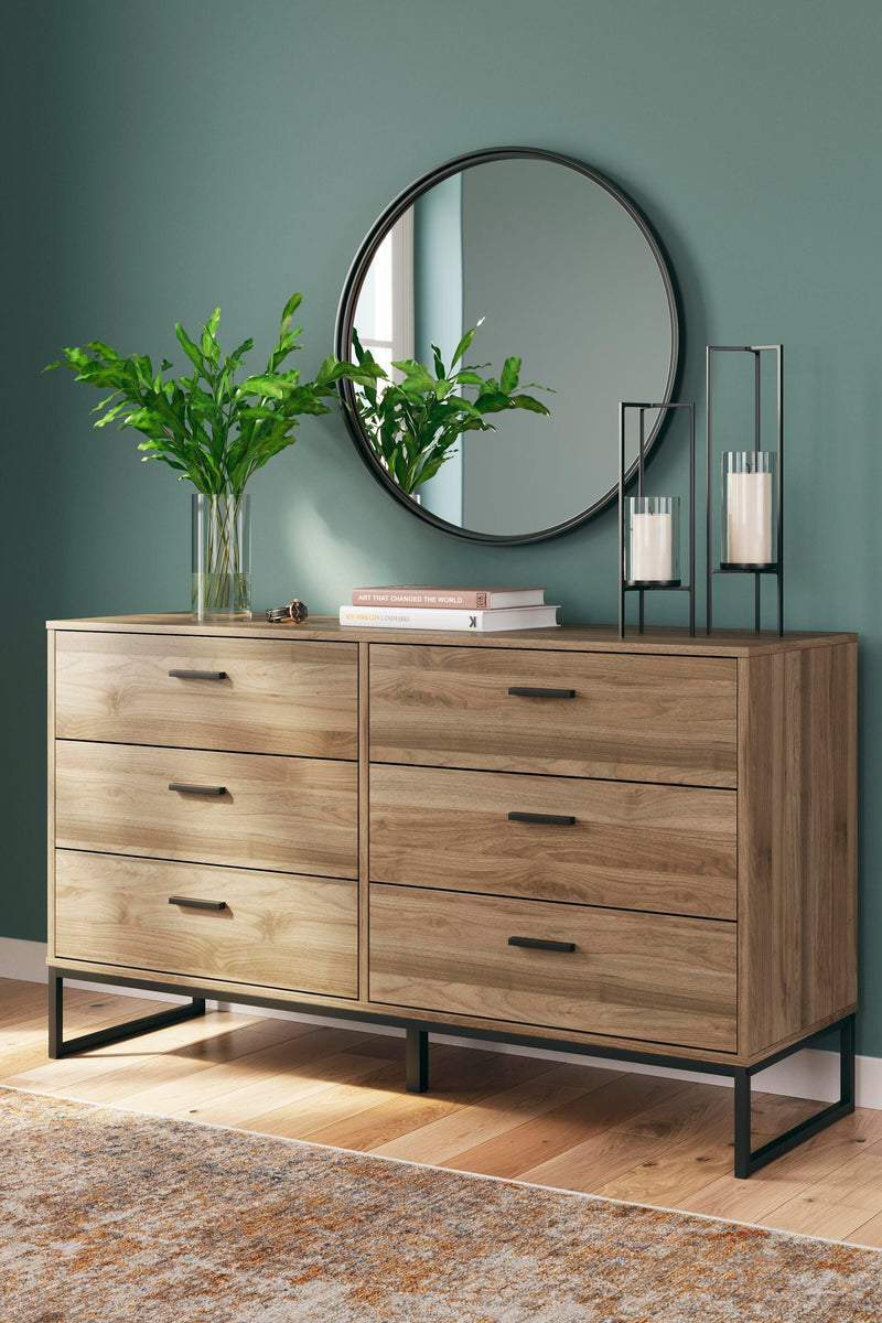 Ashley Furniture Deanlow bedroom set includes a bed, dresser, and nightstands, showcasing a modern bedroom design.