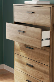 Ashley Furniture Deanlow chest of drawers with wood finish, featuring multiple drawers and modern design details.