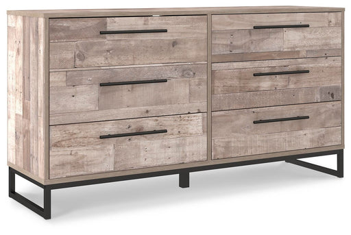 Ashley Furniture Neilsville dresser with multiple drawers, shown from an angled side view in a modern bedroom setting.