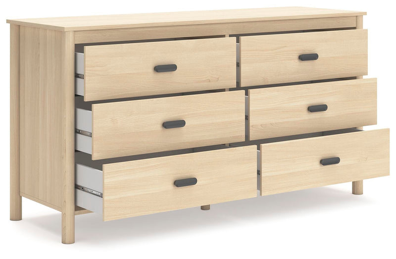 Ashley Furniture Cabinella Dresser with open drawers and angled view, showcasing its stylish wood finish and spacious storage.