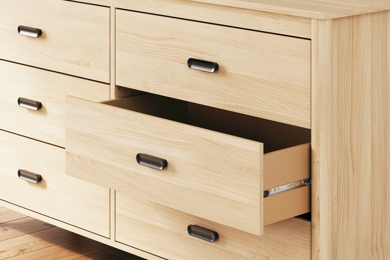 Close-up of the Ashley Furniture Cabinella Dresser showing detailed wood finish and elegant hardware.