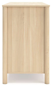 Side view of the Ashley Furniture Cabinella Dresser showing its wooden finish and multiple drawers for storage.