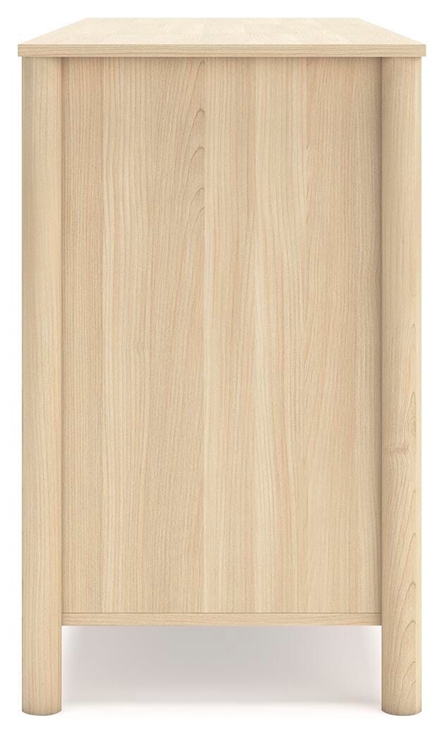 Side view of the Ashley Furniture Cabinella Dresser showing its wooden finish and multiple drawers for storage.