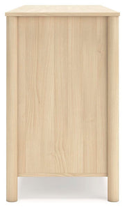 Side view of the Ashley Furniture Cabinella Dresser showing its wooden finish and multiple drawer compartments.