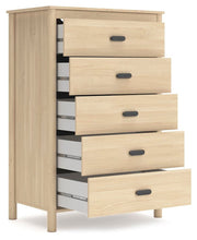 Open-angle view of Ashley Furniture Cabinella Chest of Drawers showing wood finish and multiple storage drawers.