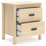 Ashley Furniture Cabinella Nightstand with open shelf and drawer, shown from an angled view in a modern bedroom setting.