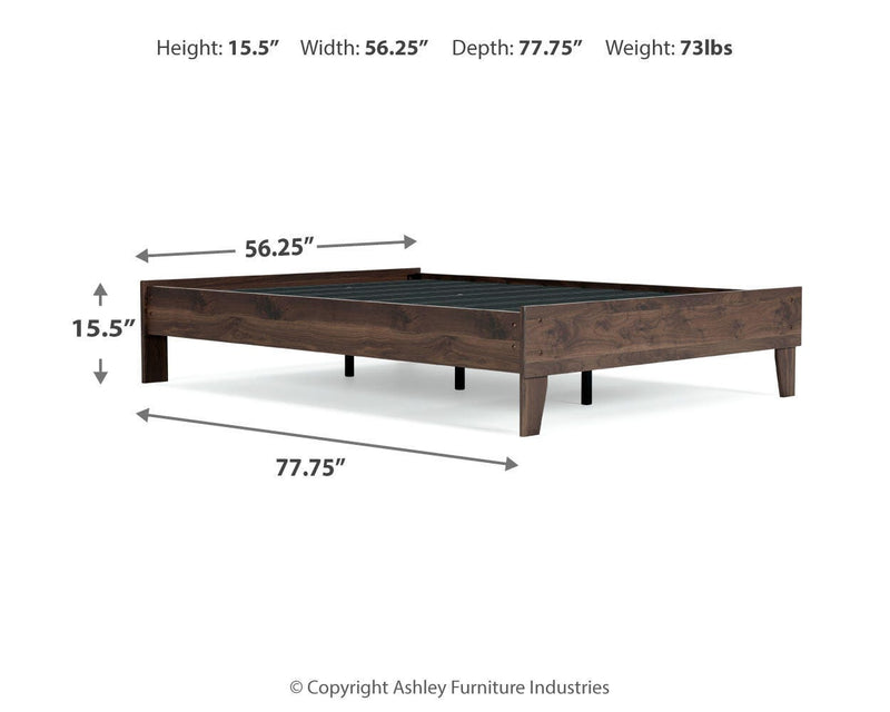 Ashley Furniture Calverson bed with upholstered headboard and wooden frame, shown in a stylish bedroom setting.
