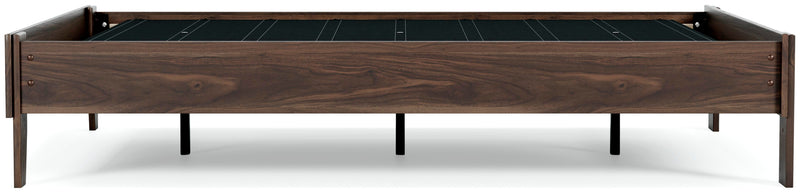 Ashley Furniture Calverson Bed with dark wood finish, showcasing a stylish bedroom bed with side view and detailed headboard design.